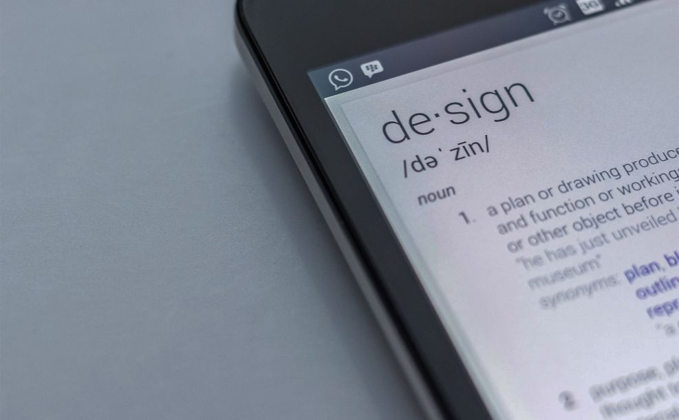 phone with the definition of design pointing to our flagstaff website design portfolio