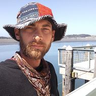 daniel standing on a pier